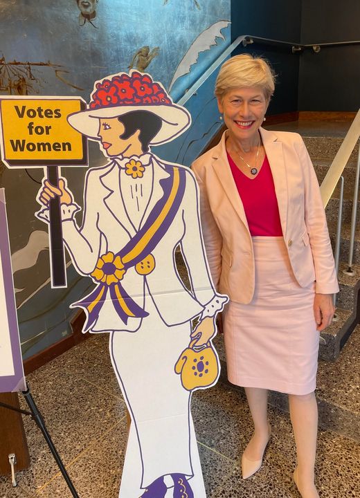 Deborah Ross with Women's Voting Rights sign.
